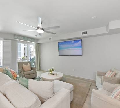 Large living area with 60 inch streaming TV and leather rocker recliner