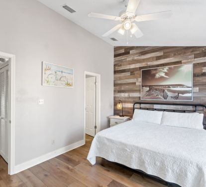 King bedroom w/ view of upstairs hallway 