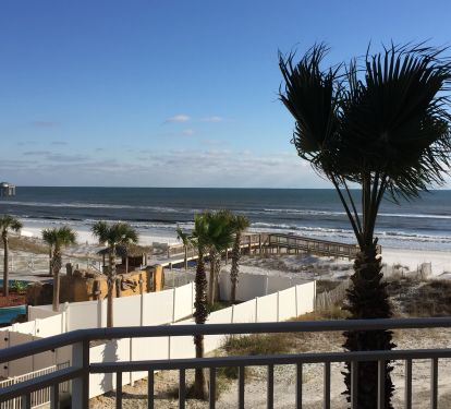 Views of Gulf from balcony; doors open fr suites and living area to balcony.