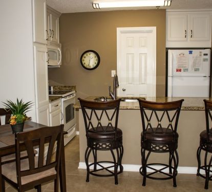 Updated kitchen cabinets,granite counter top, and bar stools, 