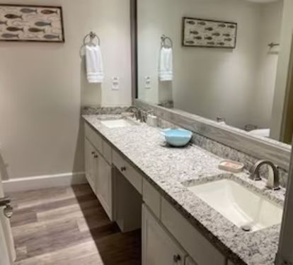 Master bathroom with double sink and tub / shower