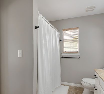 Lower level bathroom, tub/shower connected to one of the lower king bedrooms.