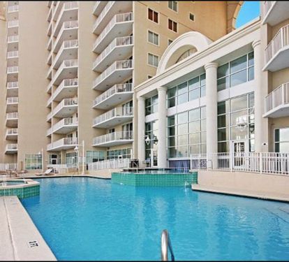 View of Majestic Sun outdoor pool and hot tub, several other pools on Seascape's property