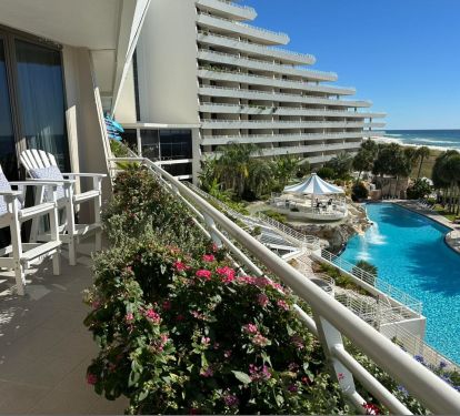 East View of Waterfall Pool &amp; Flower Planters. 