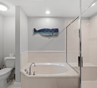 Queen Bathroom featuring tub and walk in shower 
