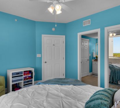 Front bedroom with bathroom door view (now has a TV)