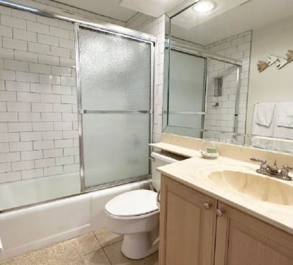 Guest bath with tub and shower.