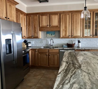 Fully stocked kitchen with granite countertops and SS appliances