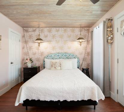 Upstairs master BR with queen bed, deck overlooking pool and ensuite bath.