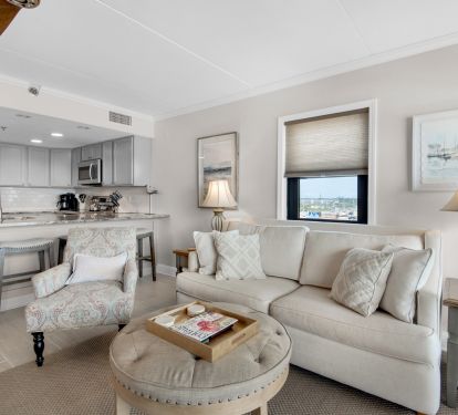 Spacious and comfortable living room, adjacent to open kitchen and dining area