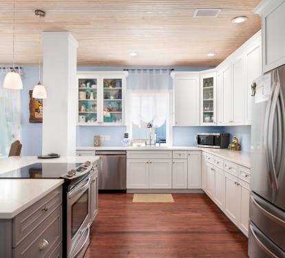 Beautiful new kitchen with new stainless steel appliances and countertops.