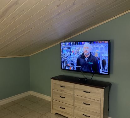 Dresser with large TV above