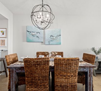 [Dining Room] Behind you is a hutch loaded with dishes and margarita glasses!