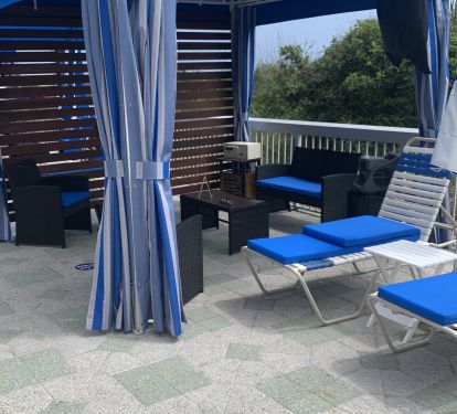 Cabanas are available for rent by the main pool. 