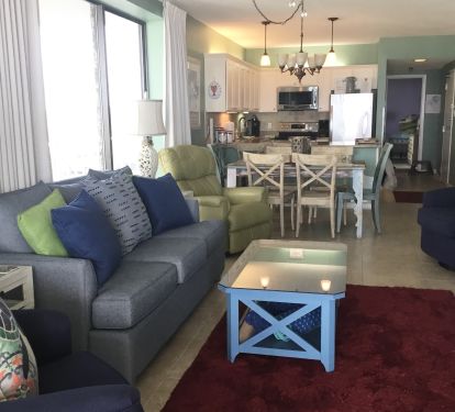 Living area flows from kitchen thro dining onto huge wrap around balcony