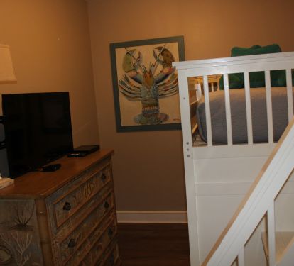The bunk room is decorated to be fun, inviting room for younger girls and boys.