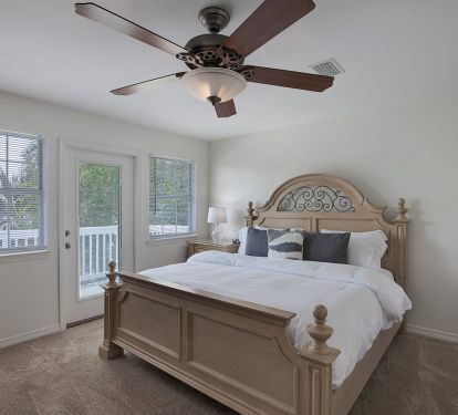 Spacious upper level king bedroom with private patio.