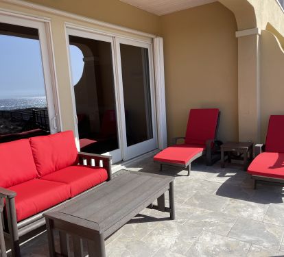 Two loungers, a love seat and two chairs available on the deck with ocean views.