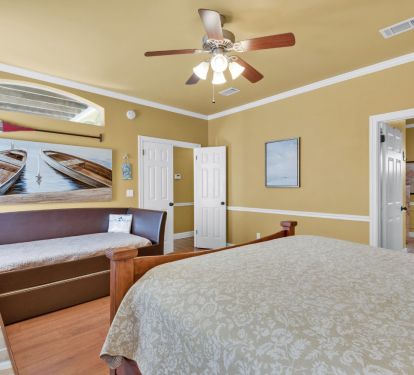 Master bedroom with King size bed, day bed, and a pull-out trundle bed.