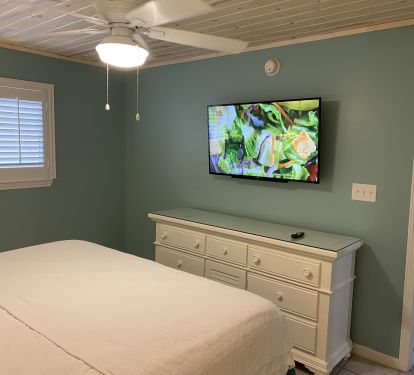 Master Bedroom with King Size Bed, dresser and Large Screen TV
