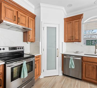 NEW quartz backsplash and counters with large corner pantry for groceries 