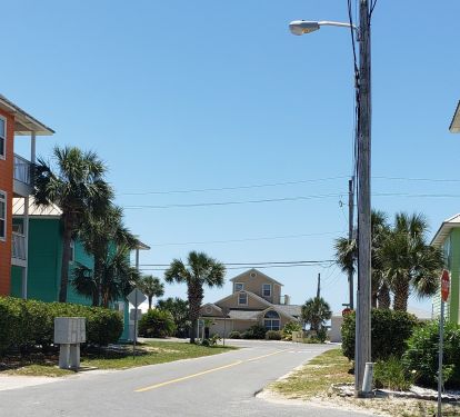 Beach entrance next to 2 story house. View from our yard, Beach is that CLOSE!!