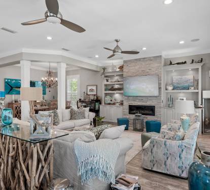 Living room includes two couches (one pull-out bed), two swivel chairs, smartTV
