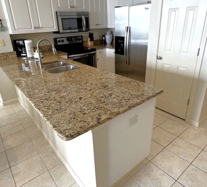 Granite counter tops with upgraded stainless appliances.