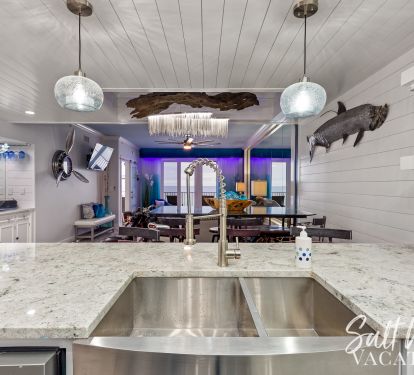 View looking from kitchen to gulf...wet bar on left, shiplap trimming 