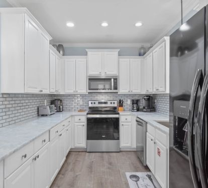 Kitchen with stove, oven, and microwave