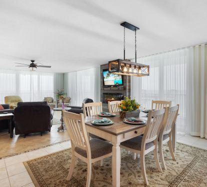open area with dining and living, soft lighting with sheer drapes plus blackouts