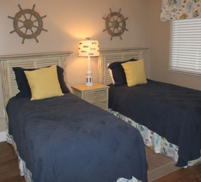 The Twin bedroom. Note that our Decorator chose a style that is welcoming to individuals of just about any age or gender. Serta Perfect Sleepers, of course.