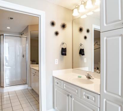 Spacious master bath with His and Her sinks with walk in shower. 