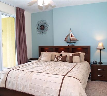 King bed in Oceanfront primary with walkout to balcony. New 43 inch Smart TV