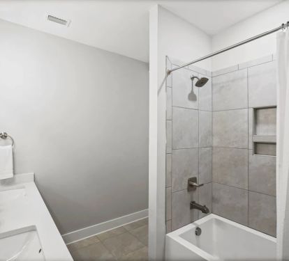 Upstairs Bathroom with Dual Vanity, Tub, and Shower