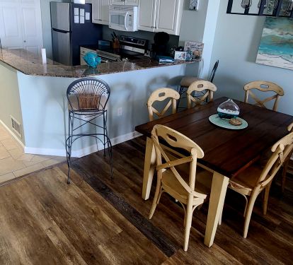 Fully stocked kitchen and dining area with direct Gulf view.