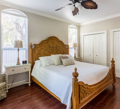 First floor king master suite with attached full bath and door to back patio
