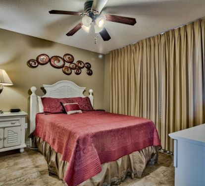 Second bedroom with queen bed and 4" memory foam topper