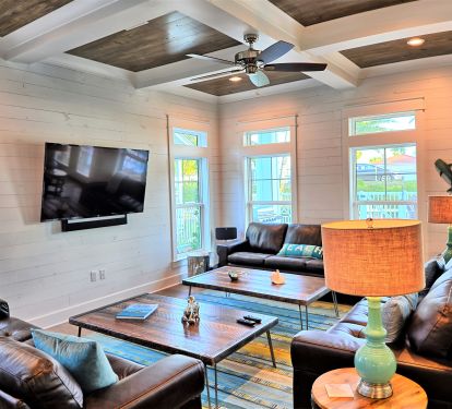 3 leather couches, 65" TV, SONOS speakers, overlooking pool