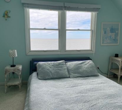 Upstairs Bedroom facing the bay.  Queen size bed.