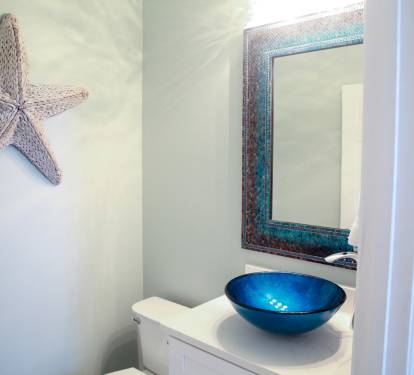 Powder room with vessel sink on main level