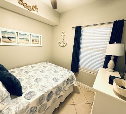 Queen 3rd Bedroom with wall-mounted smart TV
