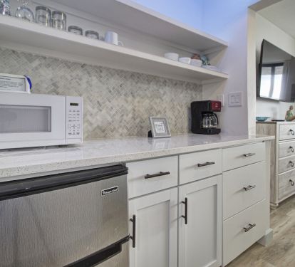 Quartz countertops, white cabinets