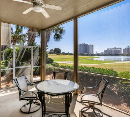 Large screened in patio has dining table