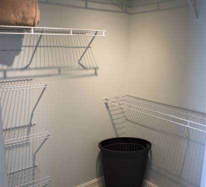 Large well lit walk-in closet in Master bedroom