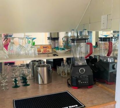 Mini Bar provides wine, martini, margarita glasses, ice bucket, blender, wine and bottle openers