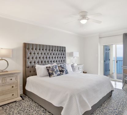Primary bedroom with balcony access and stunning Gulf view