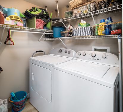 Laundry room with beach toys