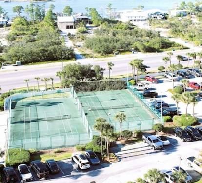 The condo boasts two tennis courts, a basketball goal, and a racquetball court. 