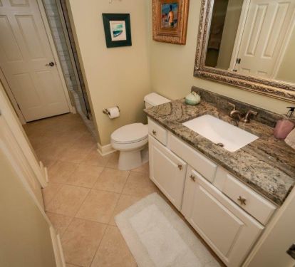 master bath with new granite counter tops and ADA toilet